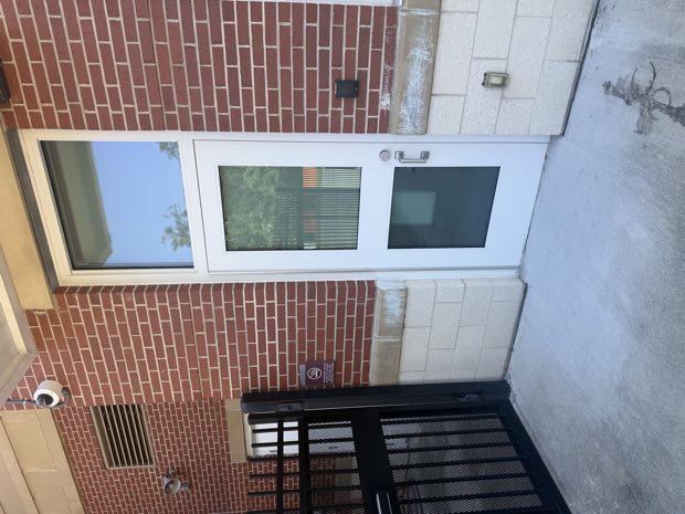 Controlled exterior door with reader on a school building