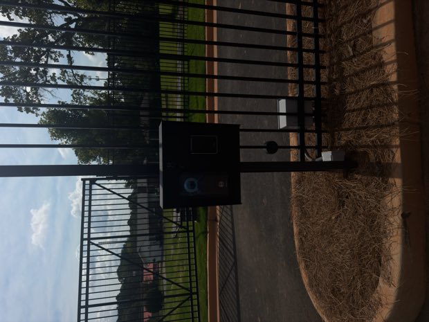 Reader and enclosure mounted at a perimeter gate post