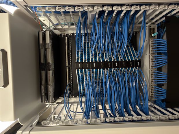 High-density rack with blue horizontal cabling