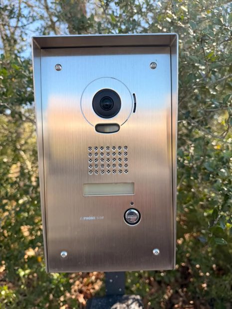 Close view of a video intercom panel camera and speaker