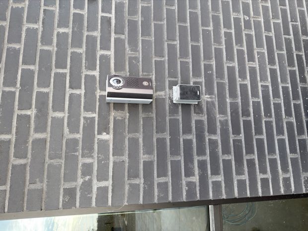 Magnetic lock and bracket mounted on a brick wall