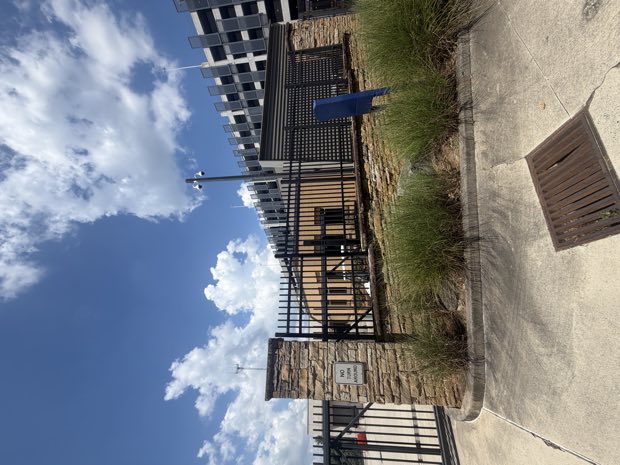 Perimeter gate with access control at a parking deck