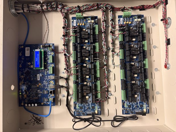 Access control relay board wired into an enclosure