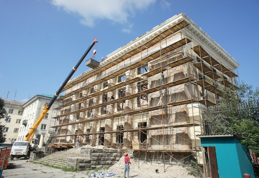 Commercial building under renovation behind scaffolding