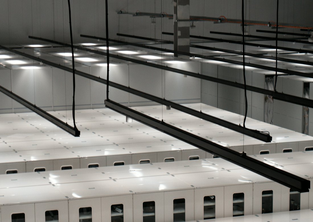 Rows of equipment cabinets in a modern data center