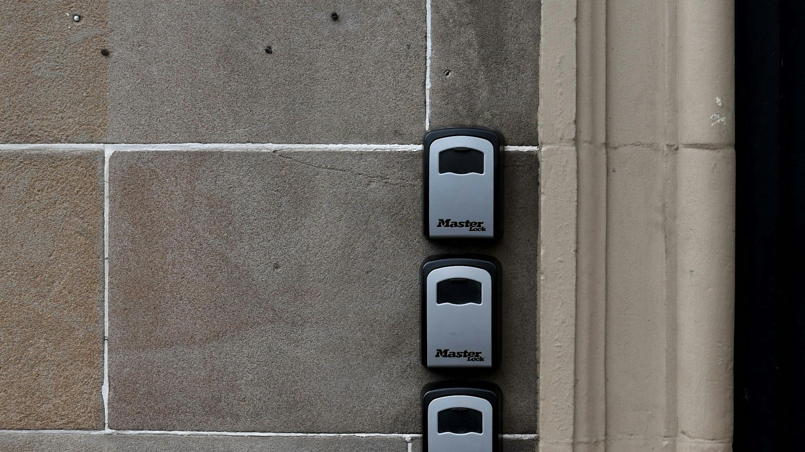 Electronic access control readers beside a secured door