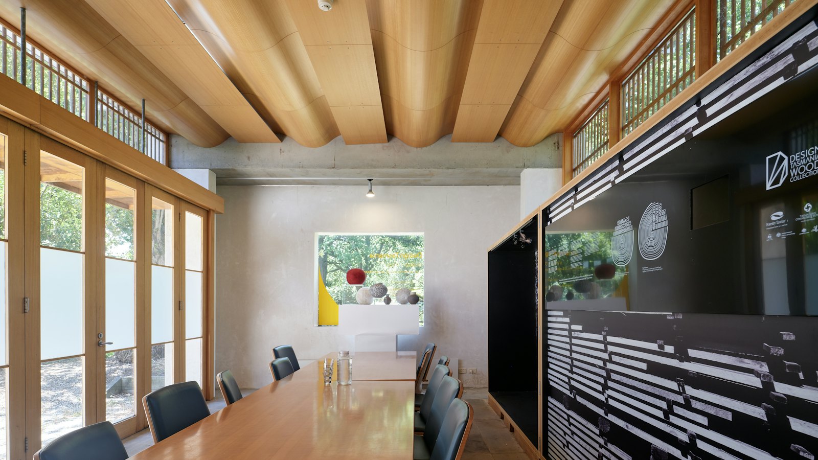 Modern conference room with a large display and conference table