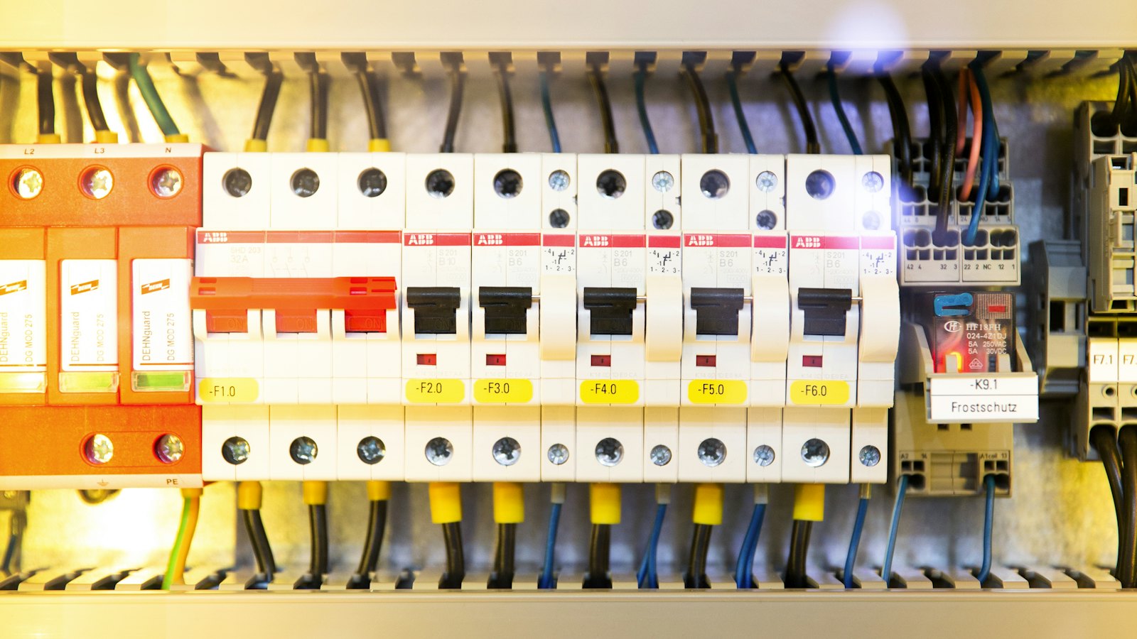 Circuit breakers and terminal blocks inside an electrical panel